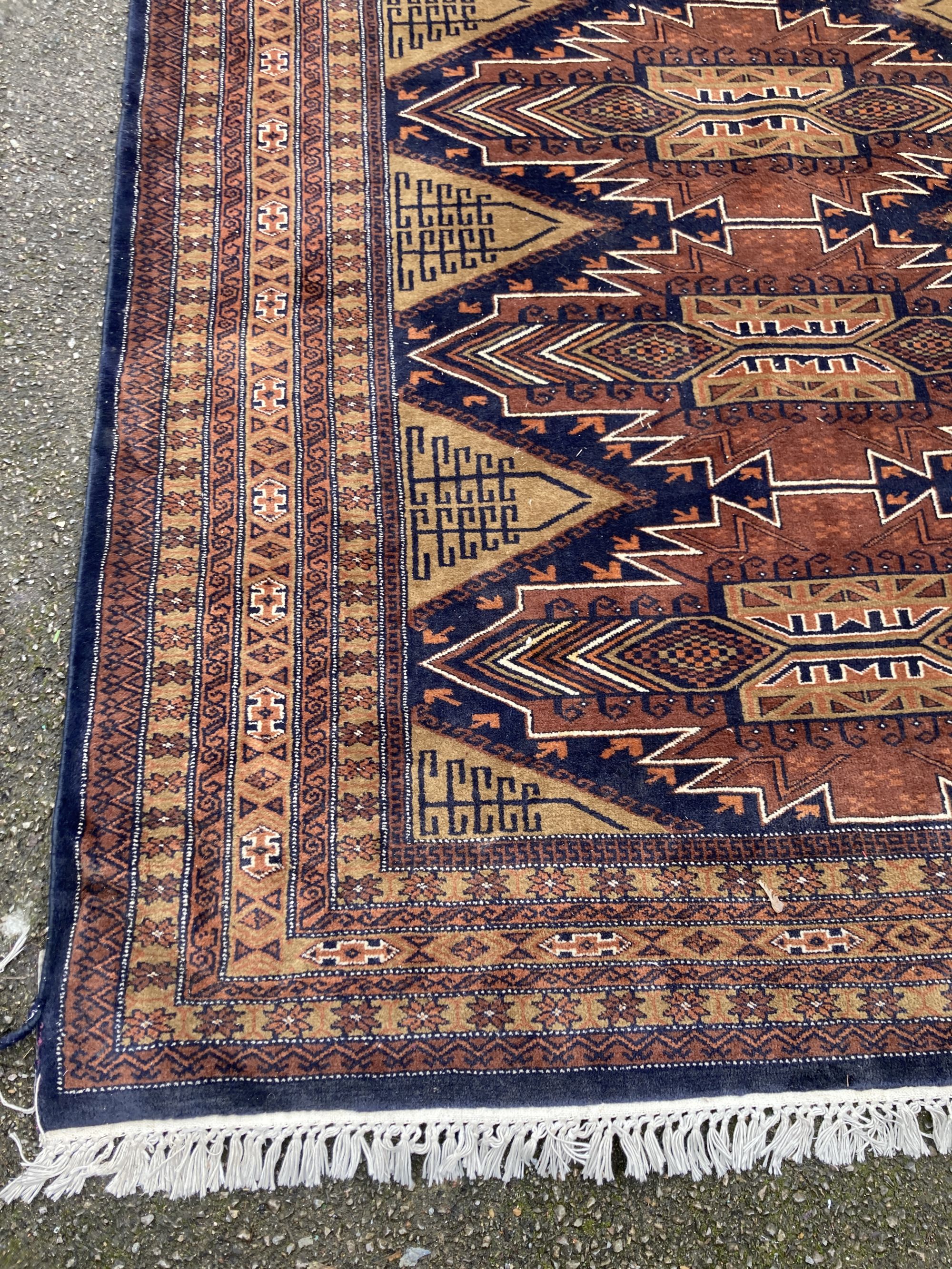 A Caucasian brown ground carpet, 280 x 190cm